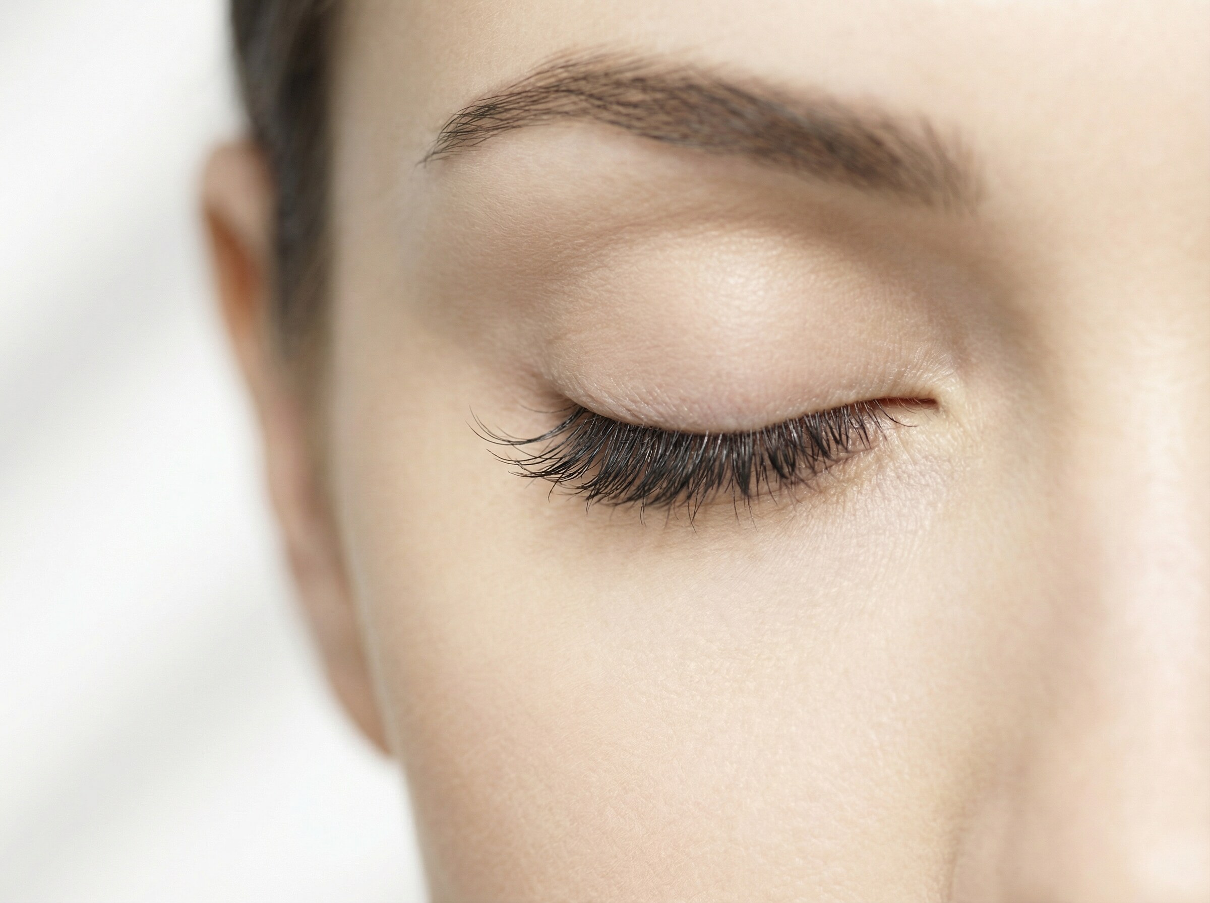 Esthetician performing a lash lift treatment